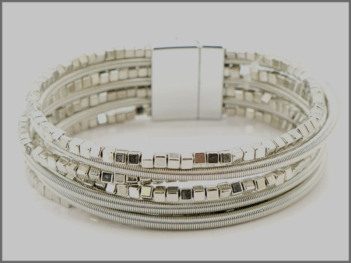 Seven Strand w/ Many Beads Silver Bracelet